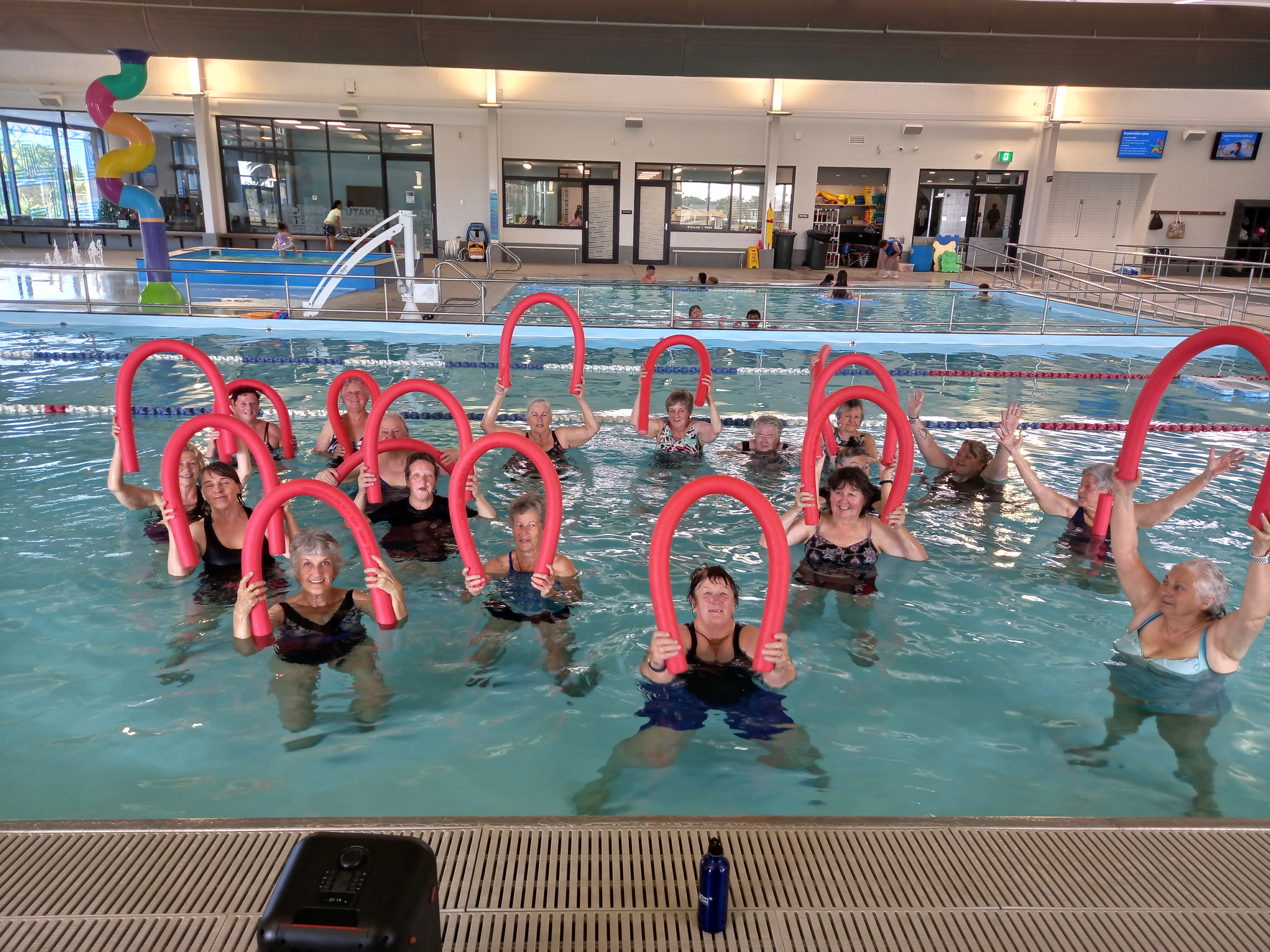 Group of older people in the pool for Aquarobics